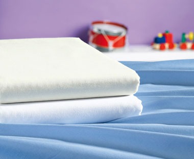 Folded white high quality bed sheets