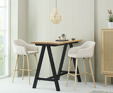Beige fabric and oak colour bar stool and natural oak/black bar table