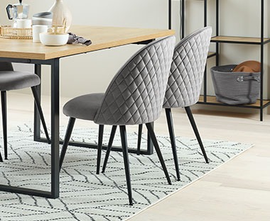 Velvet fabric and steel dining chair in grey and black
