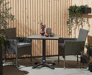 Grey bistro table with 2 outdoor chairs