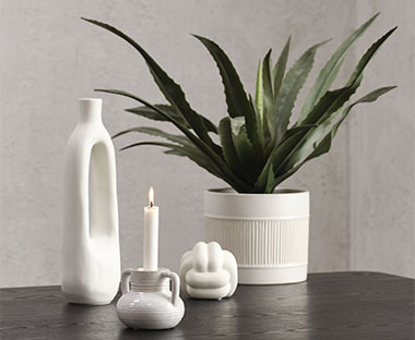 Decorations for home including sculpture, tealight holder and vase