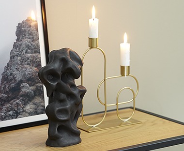 Iron candlestick available in gold