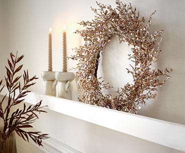 Brown Christmas wreath for your home with candlesticks