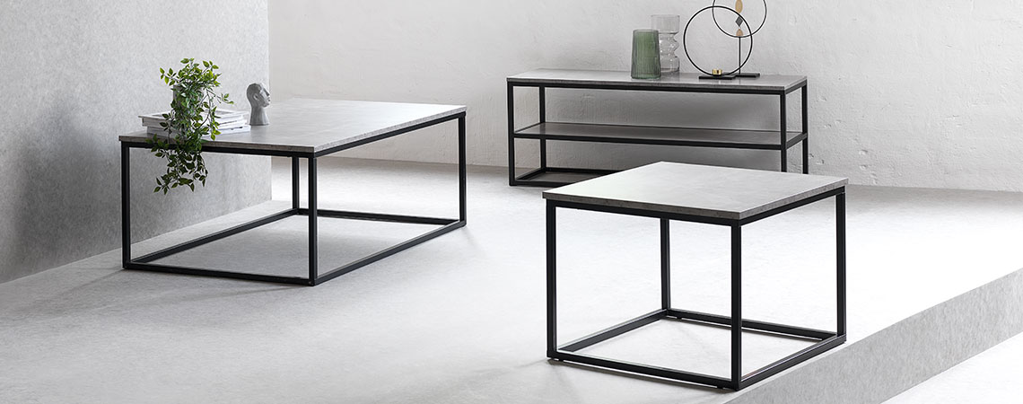 TV bench, end table and coffee table with black metal frames and a tabletop in concrete look