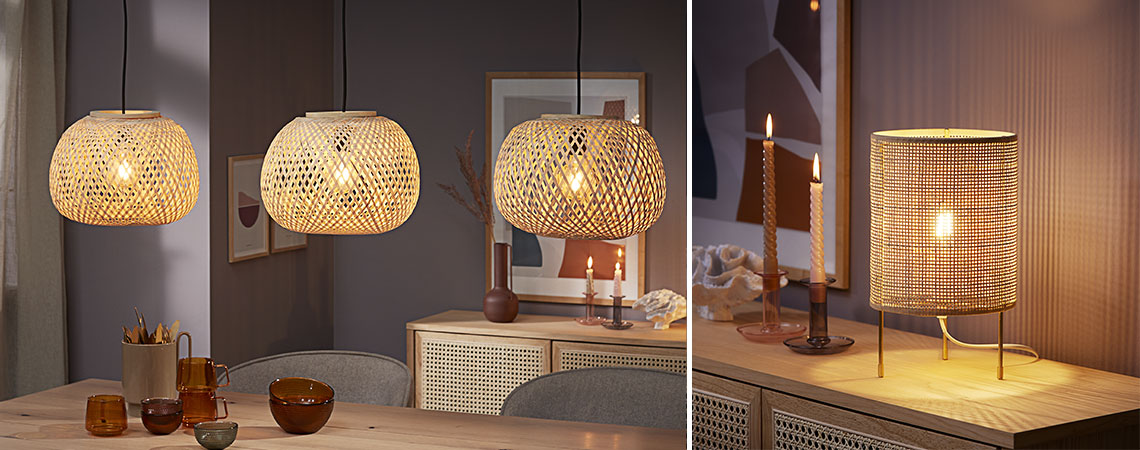 Three bamboo pendants hanging over dining table and rattan table lamp