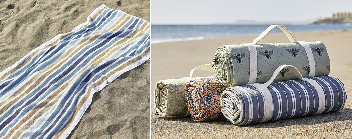 Beach towel and waterproof picnic blankets on a beach