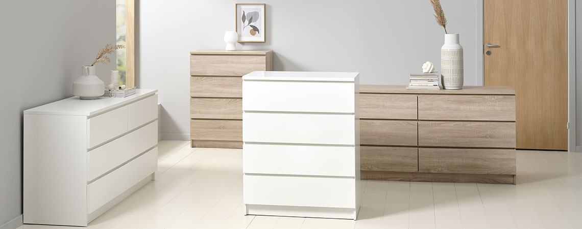 Chests of drawers in different sizes and colours 