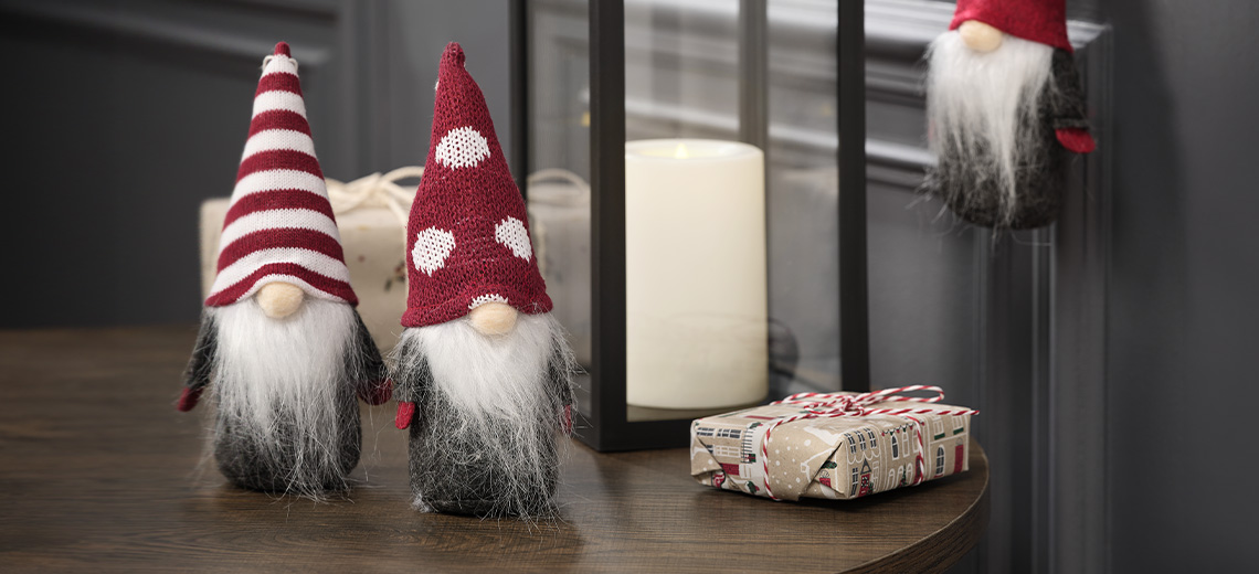 Christmas gnomes and Christmas elves in a living room decorated for the holidays