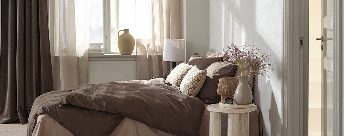 Bed with bedding, including bed sheets, duvet cover, and pillow cover