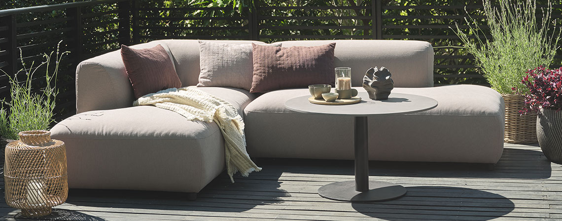 All-weather lounge sofa on a wooden patio