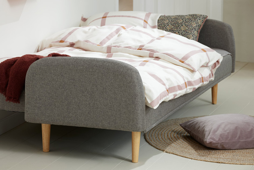 Sofa bed in grey with oak legs