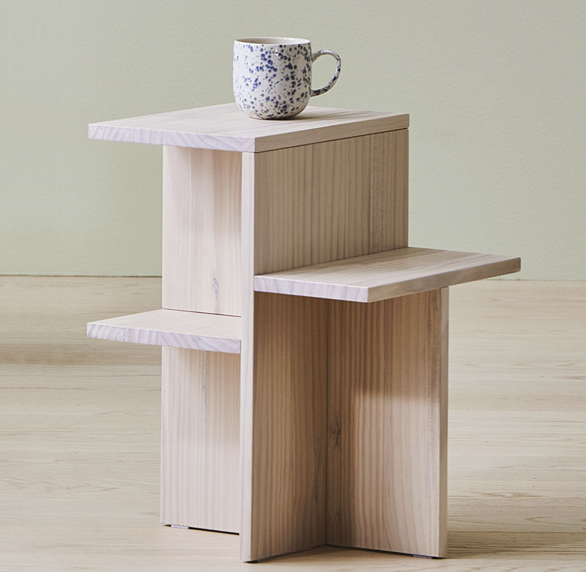 Wooden pedestal made from pine that also serves as an end table