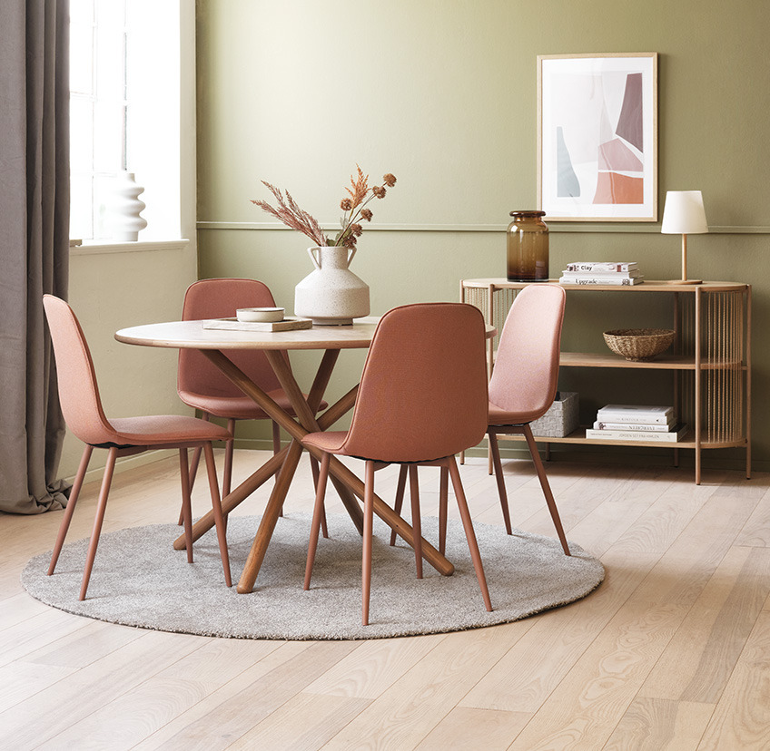 BISTRUP dining chair in soft peach Coral dining chairs around round dining table in living room