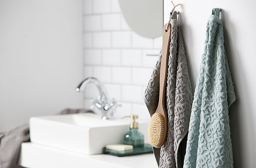 Patterned towels hanging in a bathroom