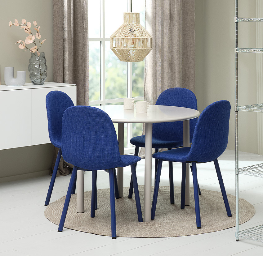 Cobalt blue dining chair and round dining table in white 