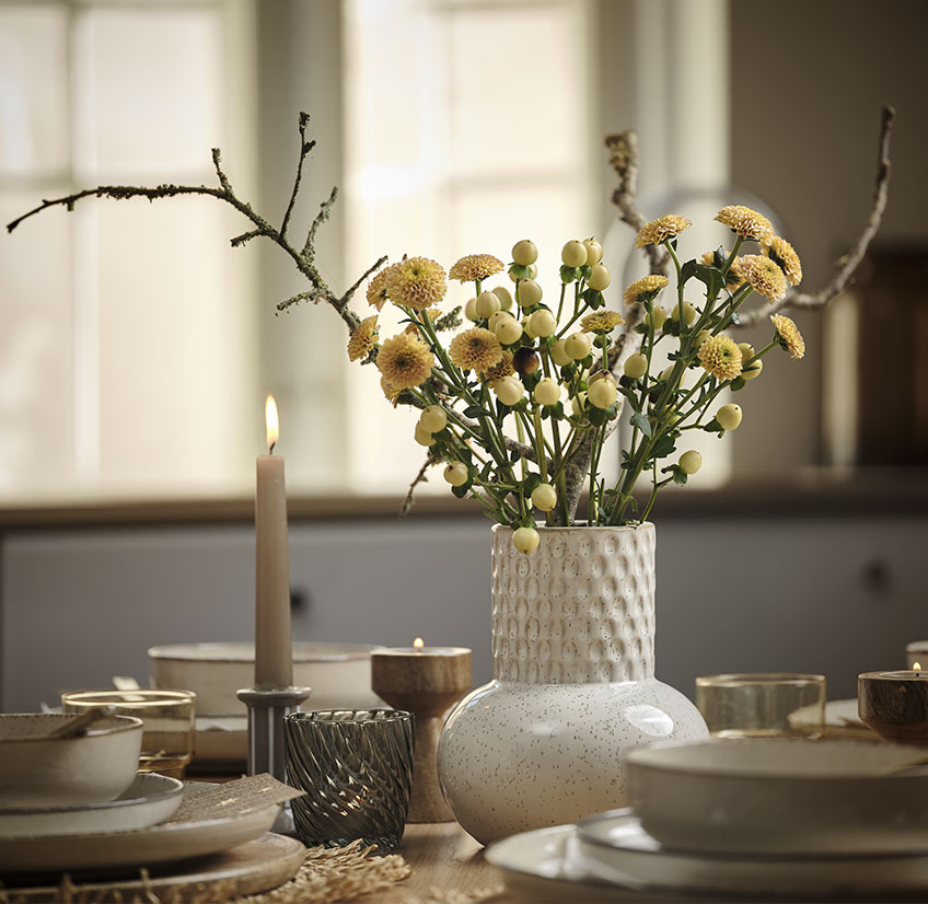 Stoneware vase with yellow flowers 