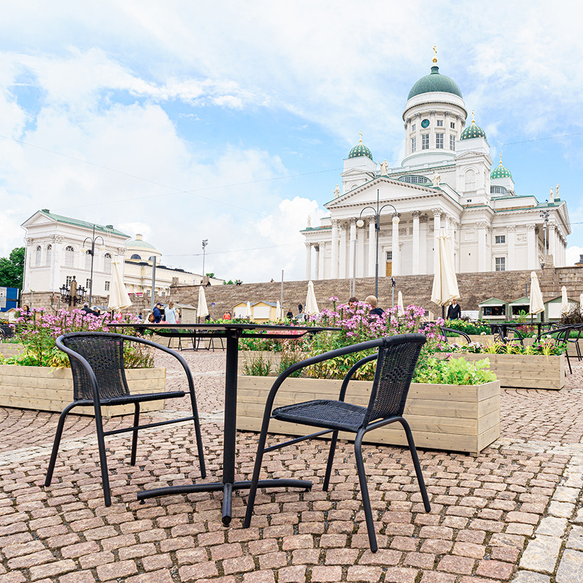 GRENAA stackable chair and XXX garden table Senate Square equipped with garden furniture