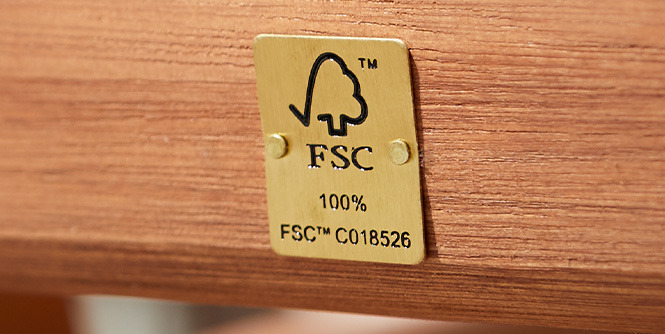 Metal plaque with FSC logo on hardwood furniture