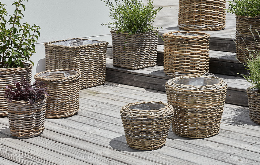 Rattan wicker garden planters in a variety of shapes and sizes