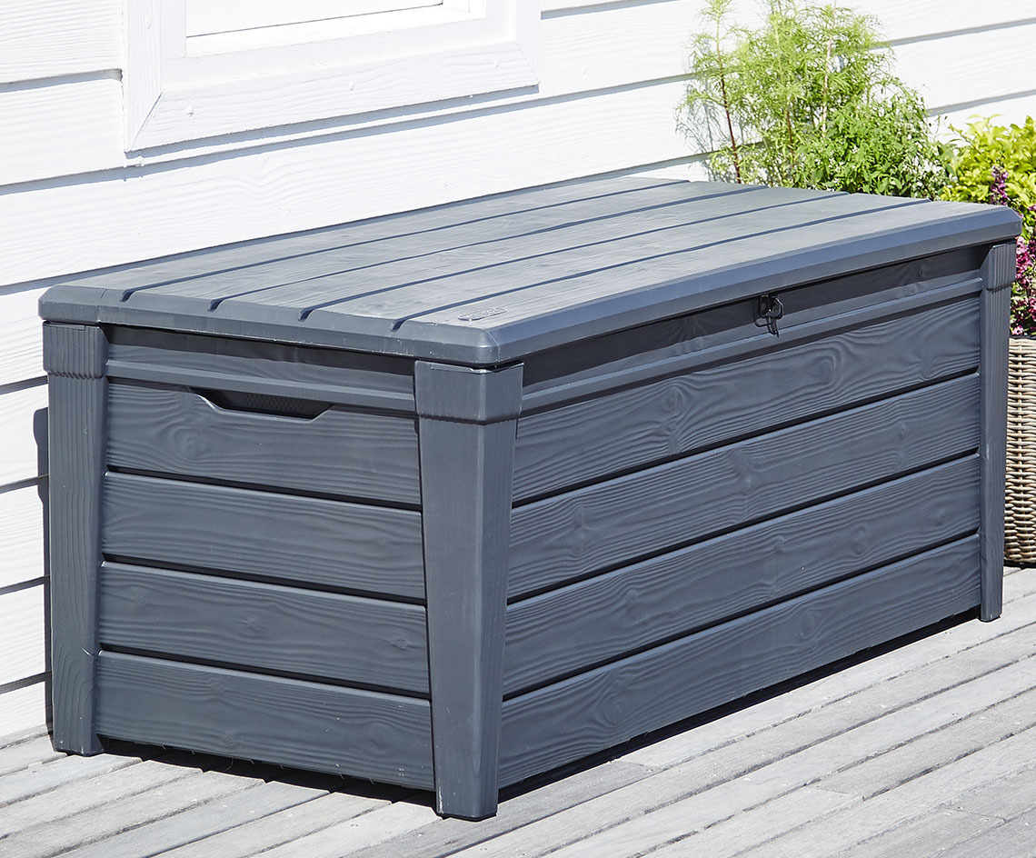 Grey cushion storage box on a wooden patio