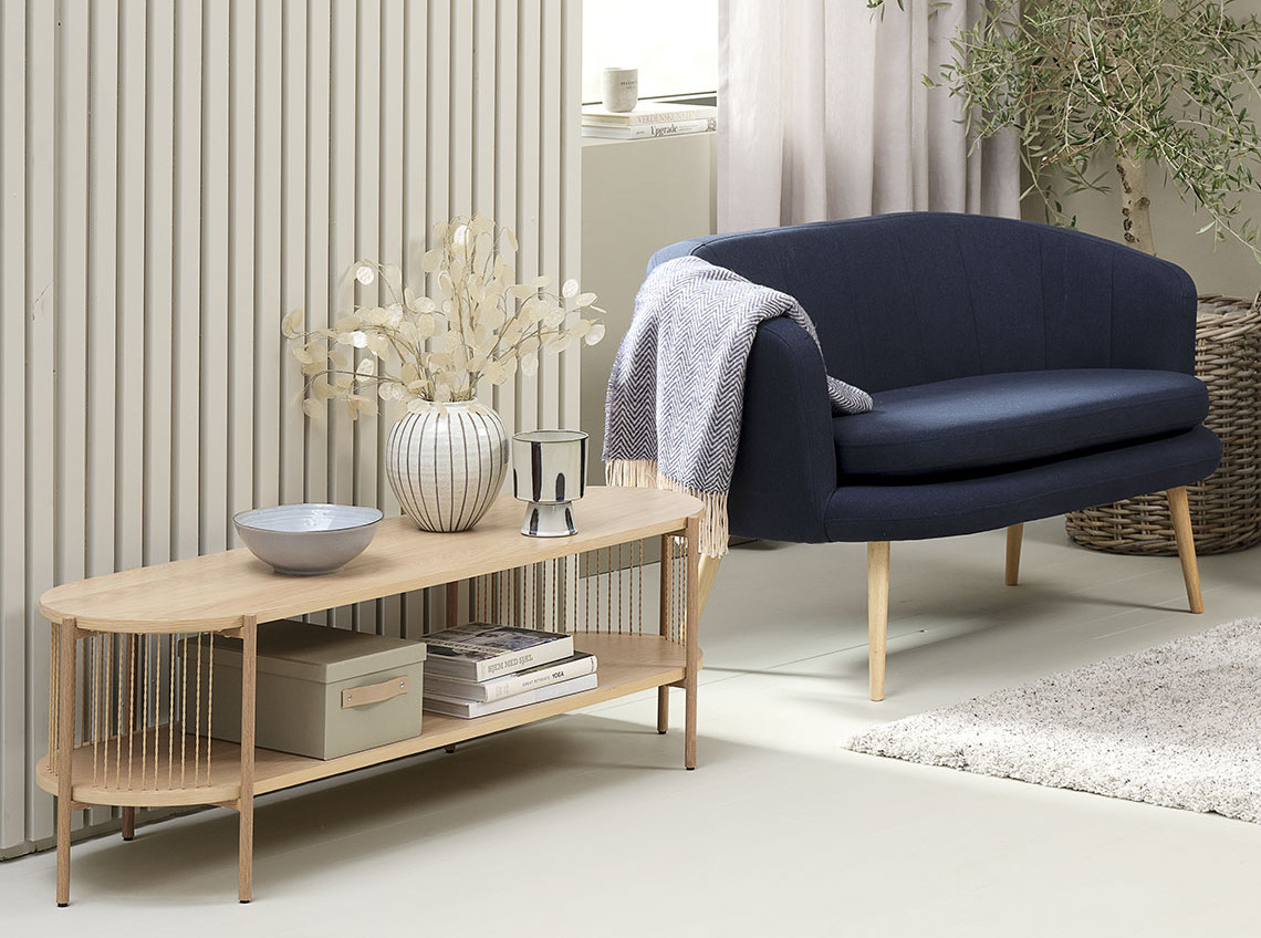 Living room with light-coloured TV bench