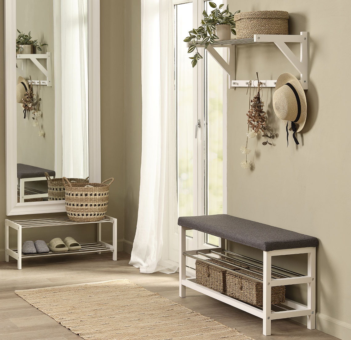 Shoe rack bench in a hallway with large mirror, rug and hallway shelf 