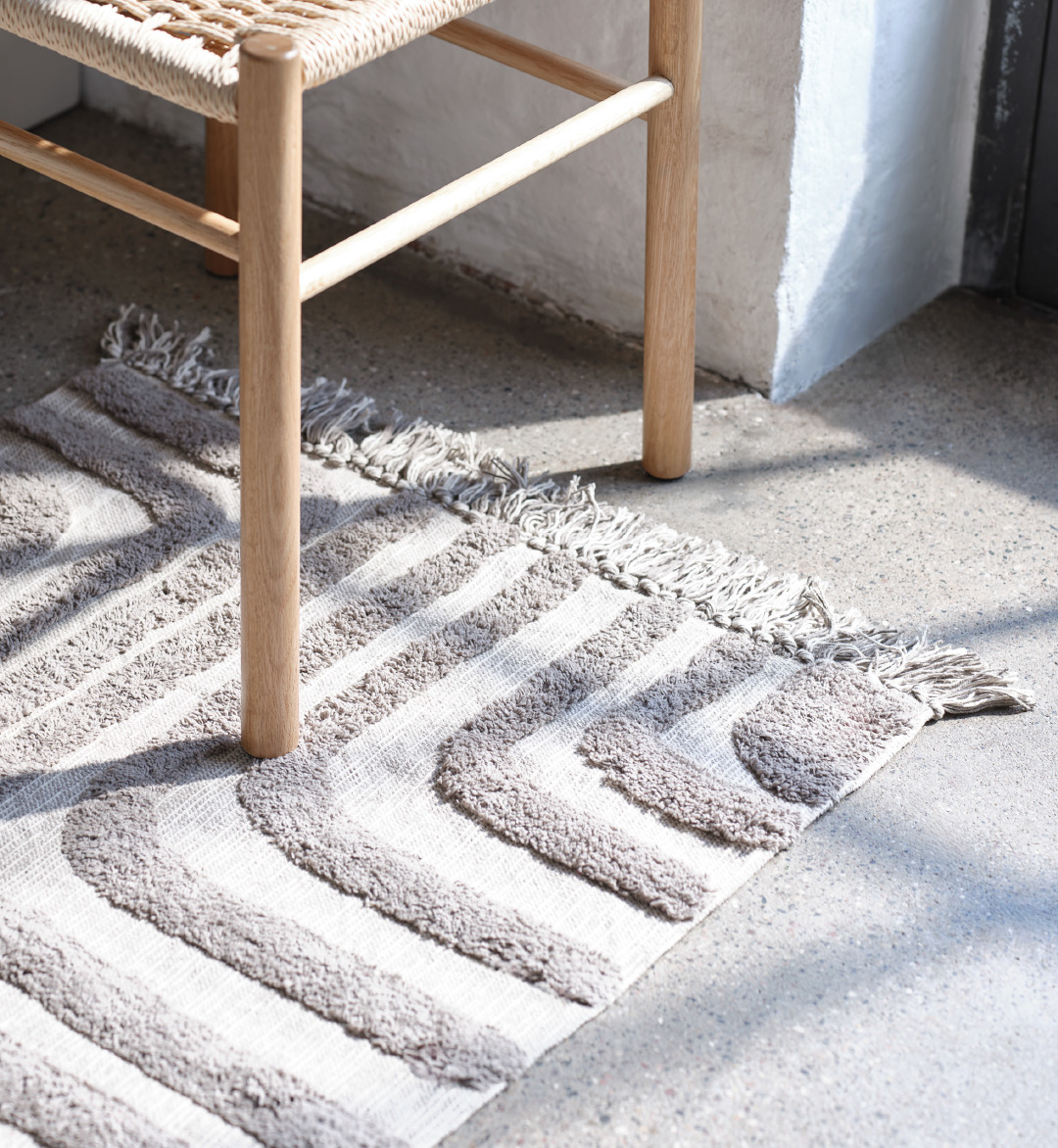 Fabric rug with wooden chair