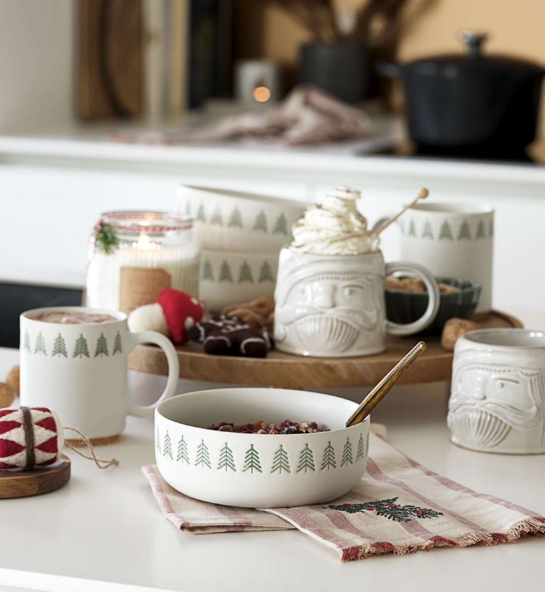 White ceramic Christmas bowl and mugs on a tablescape