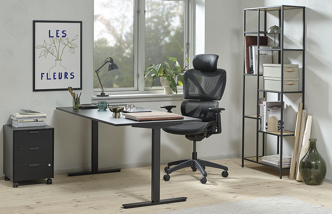 Home office with height-adjustable desk, office chair and bookcase