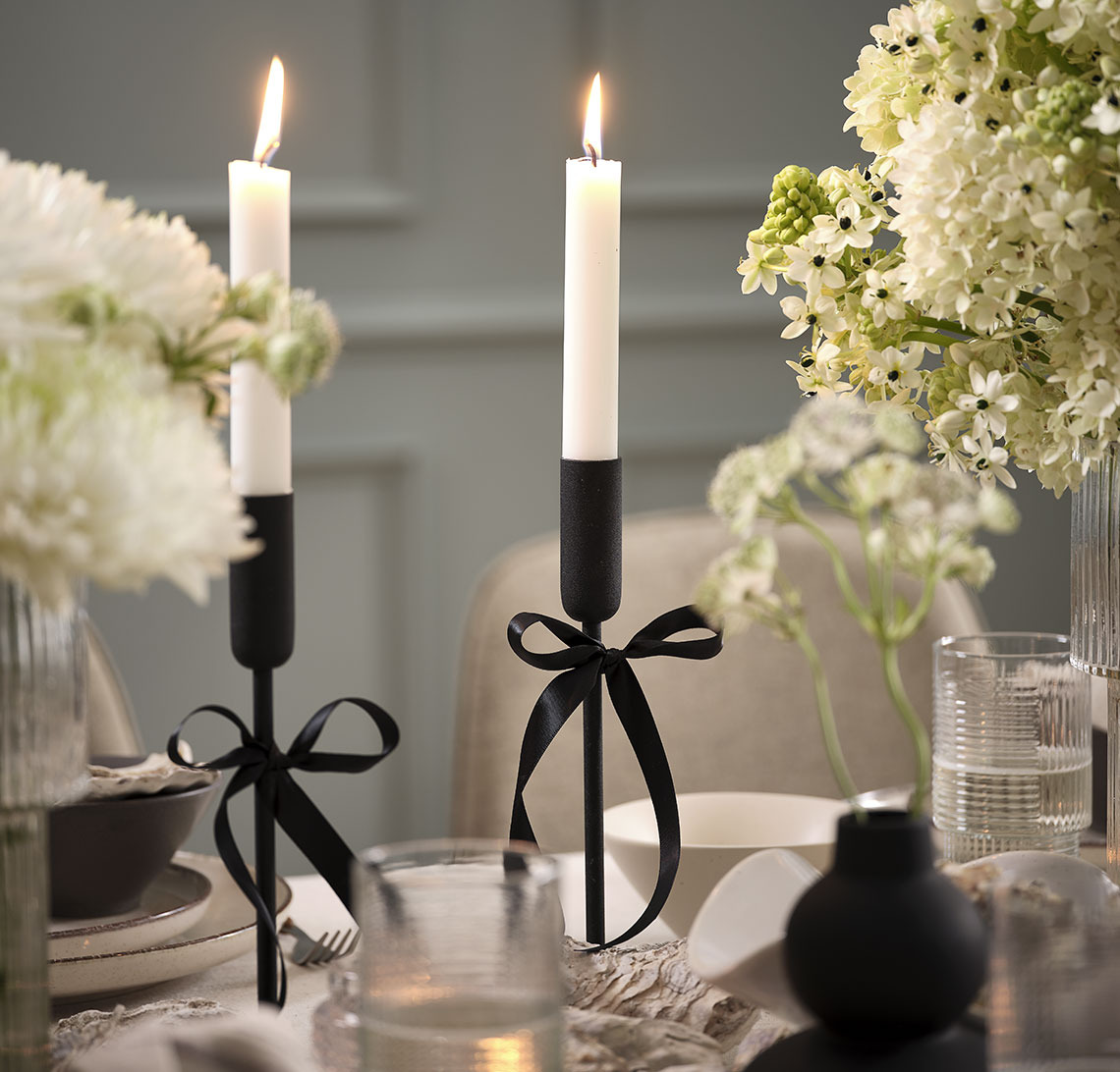 Candlesticks and candles on a New Year’s table 