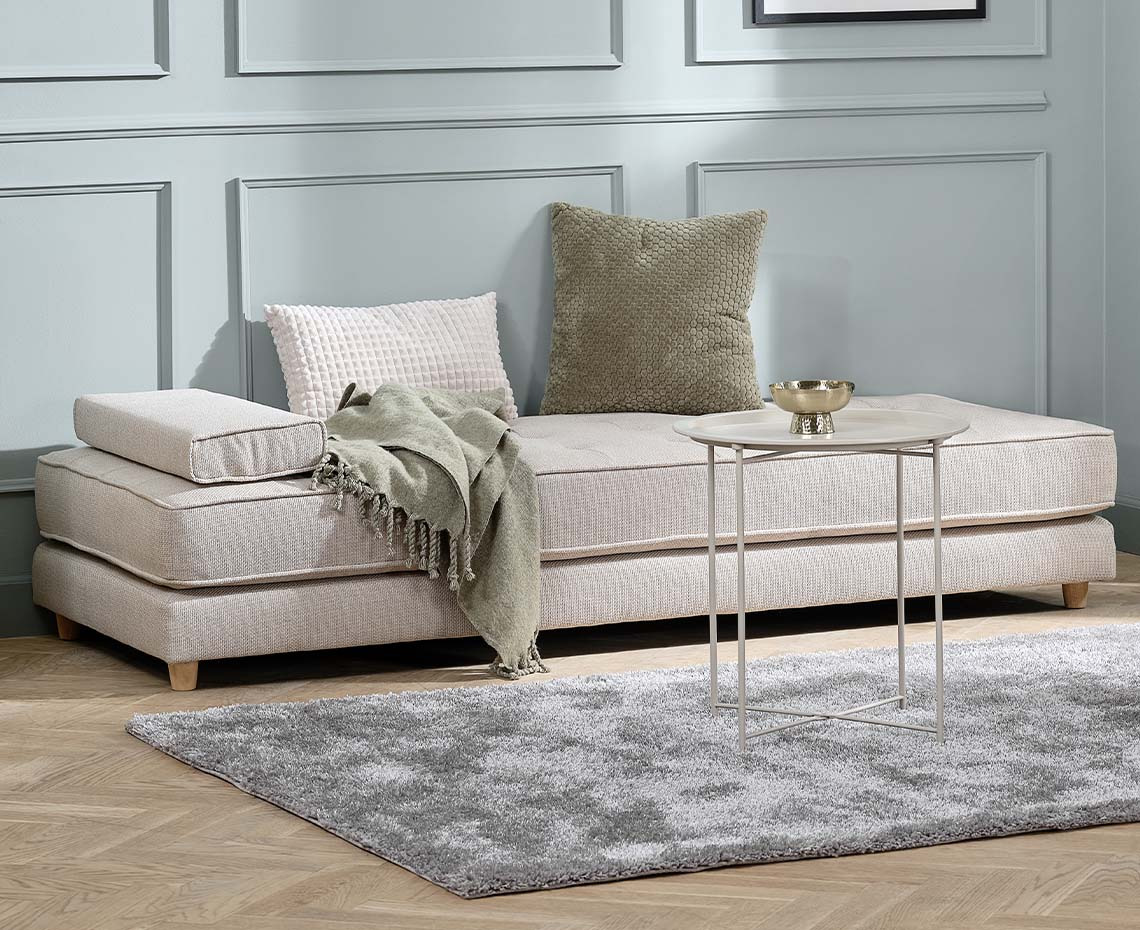 Beige daybed with armrest cushion