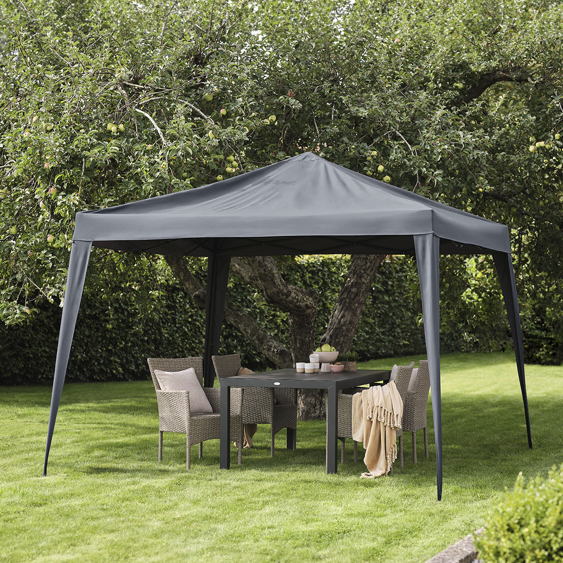 Dark grey gazebo in a garden with lounge furniture