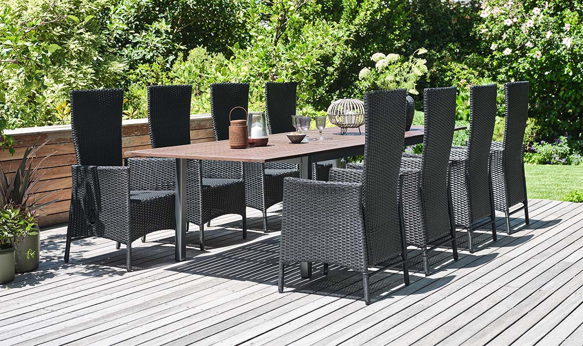 Large garden table and chairs for 8 or 10 people on patio in garden