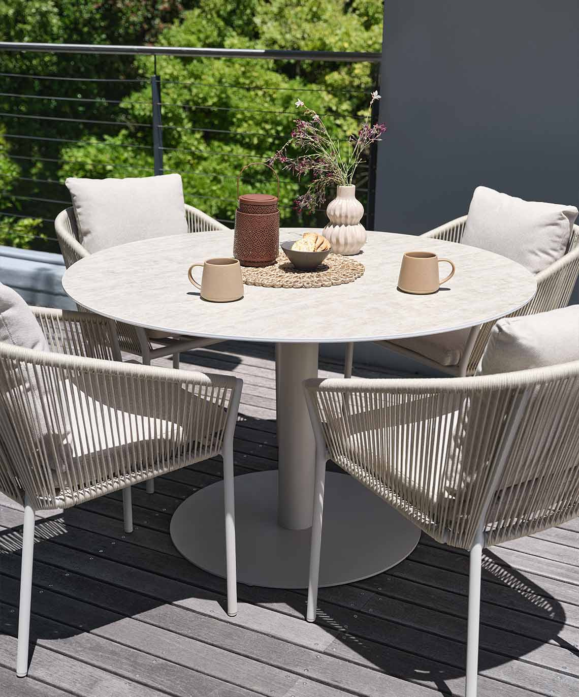 Round garden table and chairs in beige colour