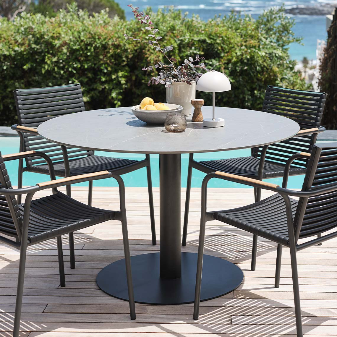 Fibre cement table top garden table and garden chairs