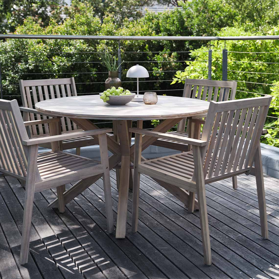 Round garden table and garden chairs made from solid acacia hardwood 