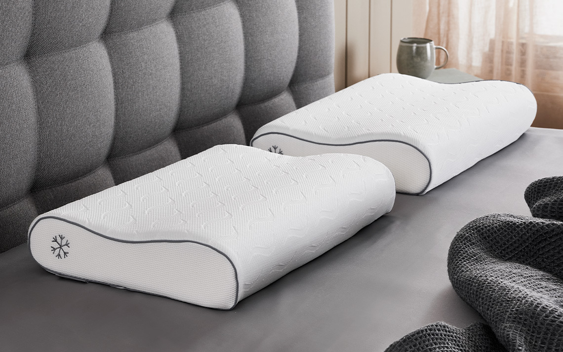 HAMMAREN memory foam pillow with cooling gel layer and cooling cover Two cooling pillows made with memory foam filling and cooling cover on bed