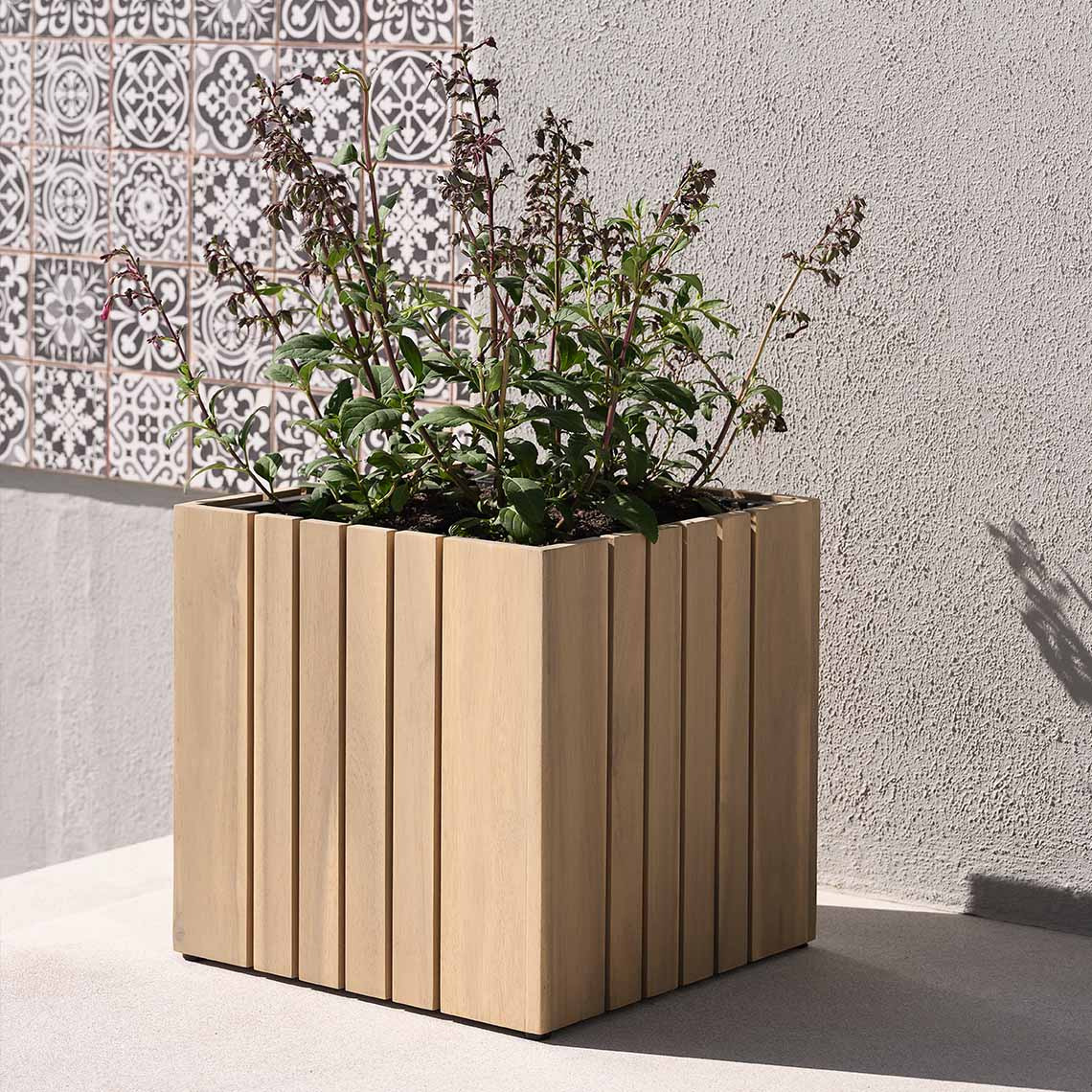 Hardwood garden planter made with solid acacia on patio