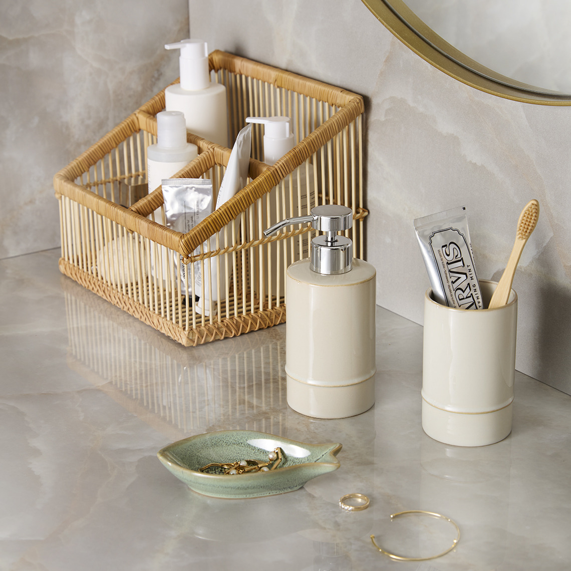 Bamboo bathroom organizer, soap dispenser and toothbrush holder in a bathroom