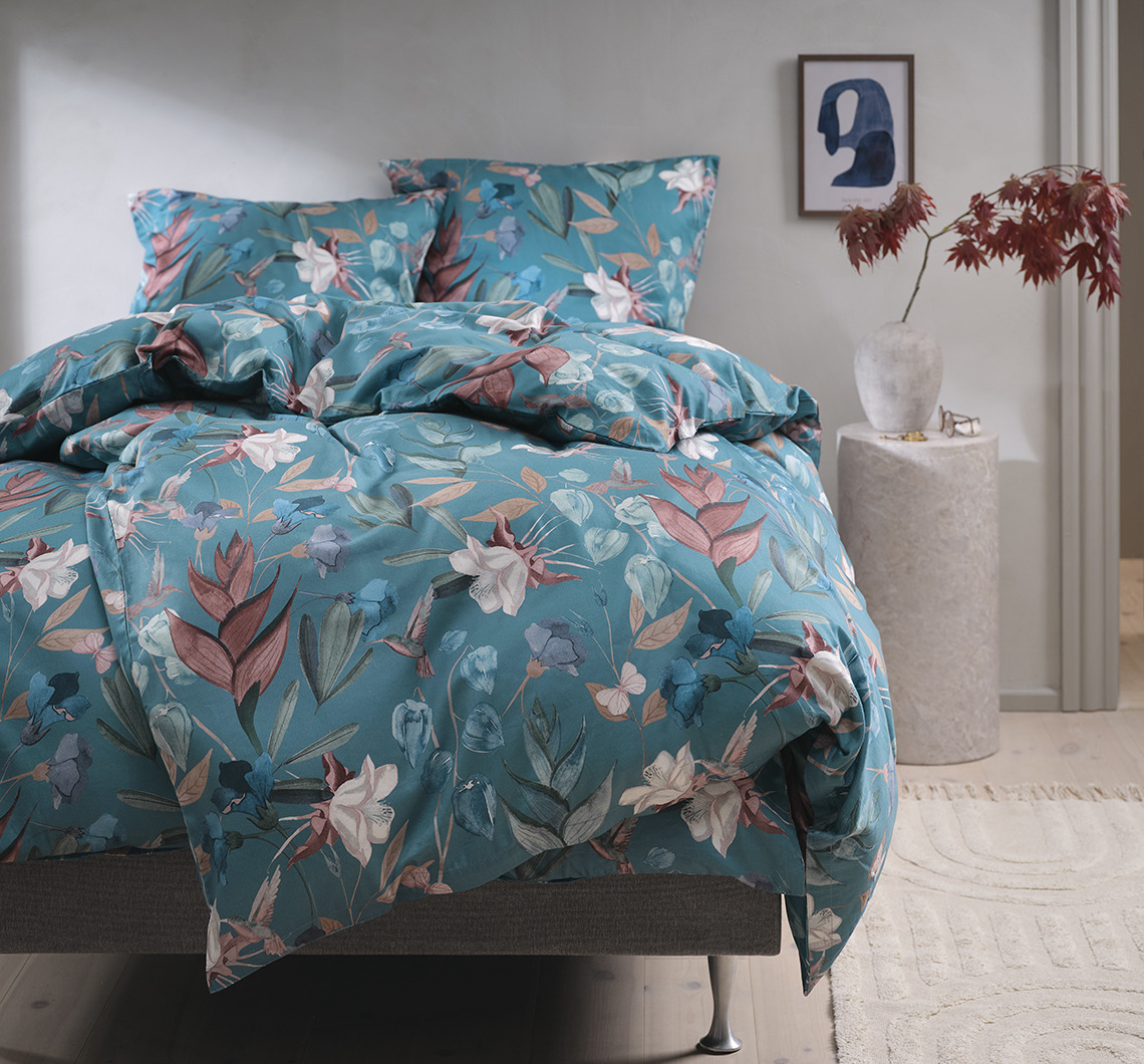 BERTHA duvet cover set has large floral motifs on a petrol background Floral bed linen in bedroom