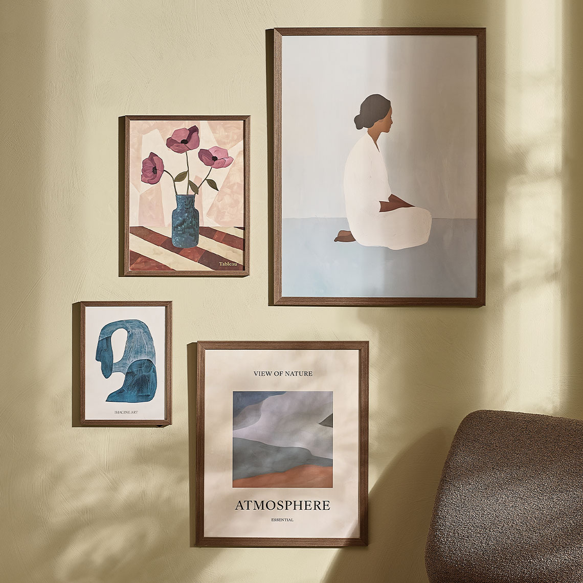 Photo frames made with dark wood in different sizing hanging on wall 