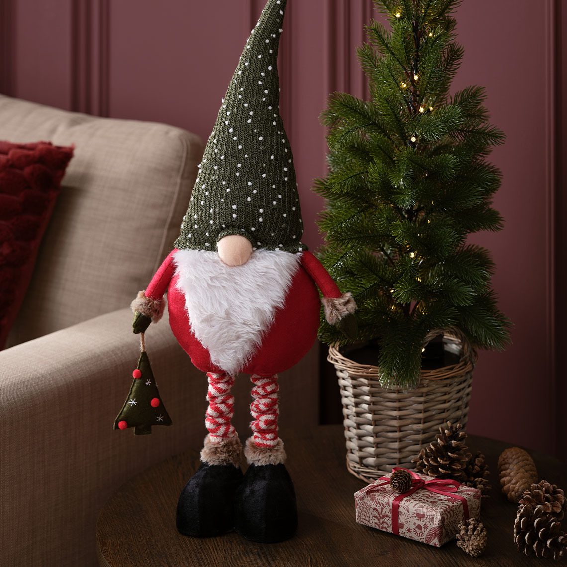 The KULDE Christmas elf has a cute button nose and a big, white beard Scandinavian Christmas elf with button nose, white beard, and grey hat