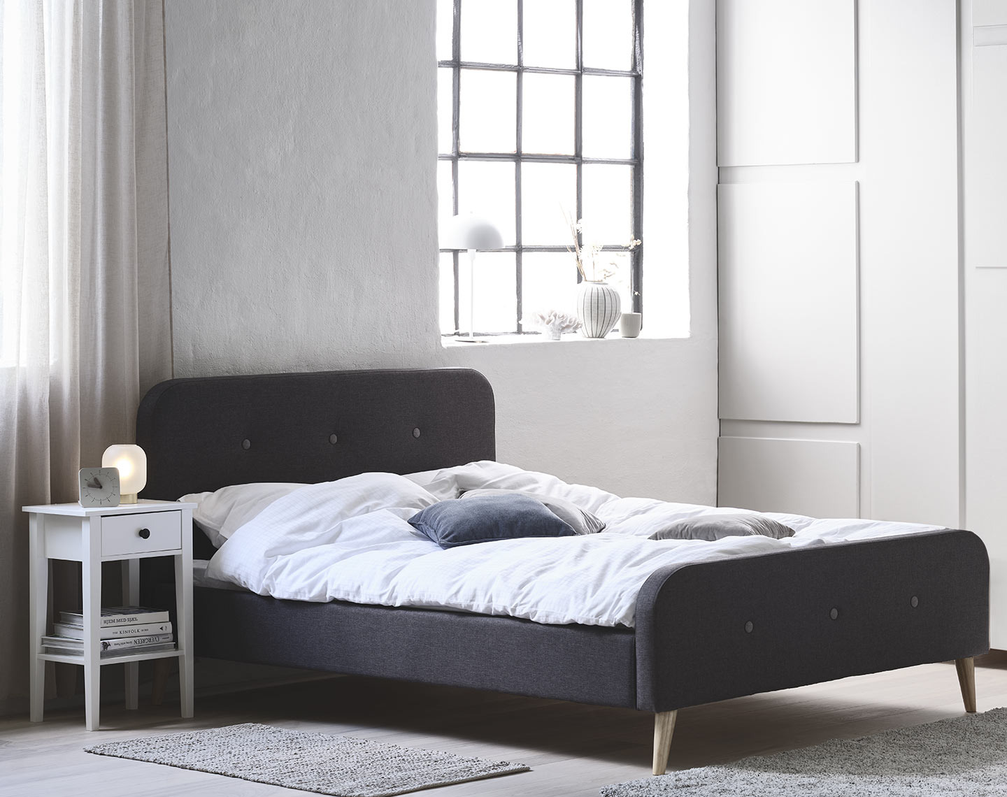 Upholstered bed frame in a bedroom with 