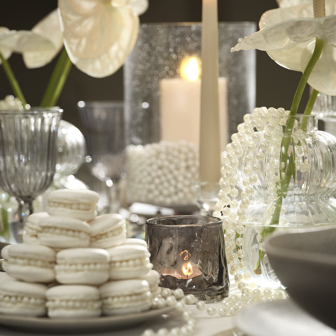 Macarons and pearls on a festive dinner table