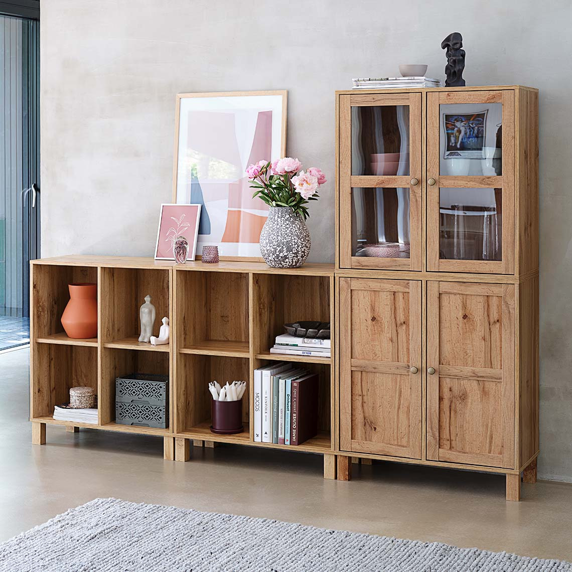 Wall unit modules in three variants; a unit with four compartments, a unit with two doors and a unit with two doors with glass panes