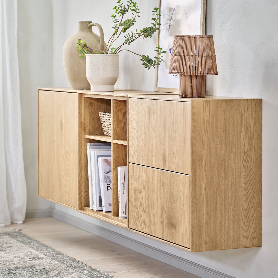 Modular wall storage units in three variants; a unit with 2 drawers, a unit with 4 compartments and a unit with 1 door