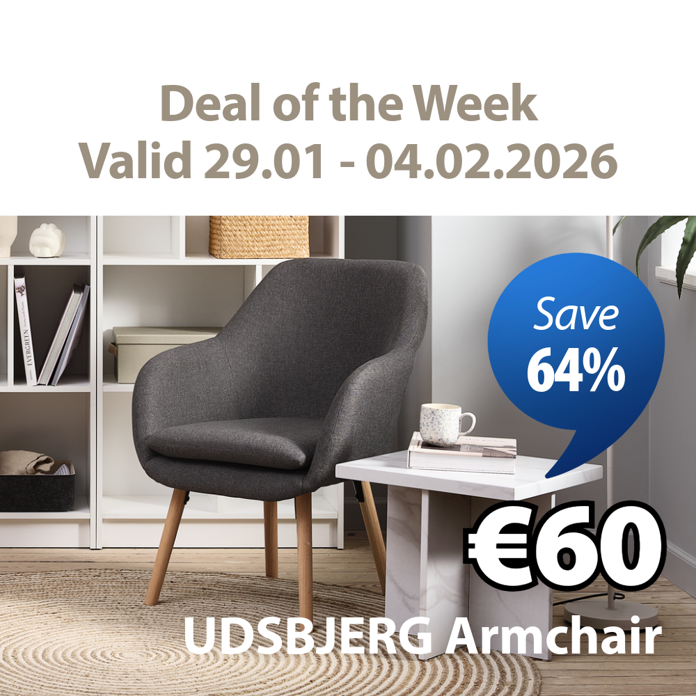 grey armchair in front of book shelf