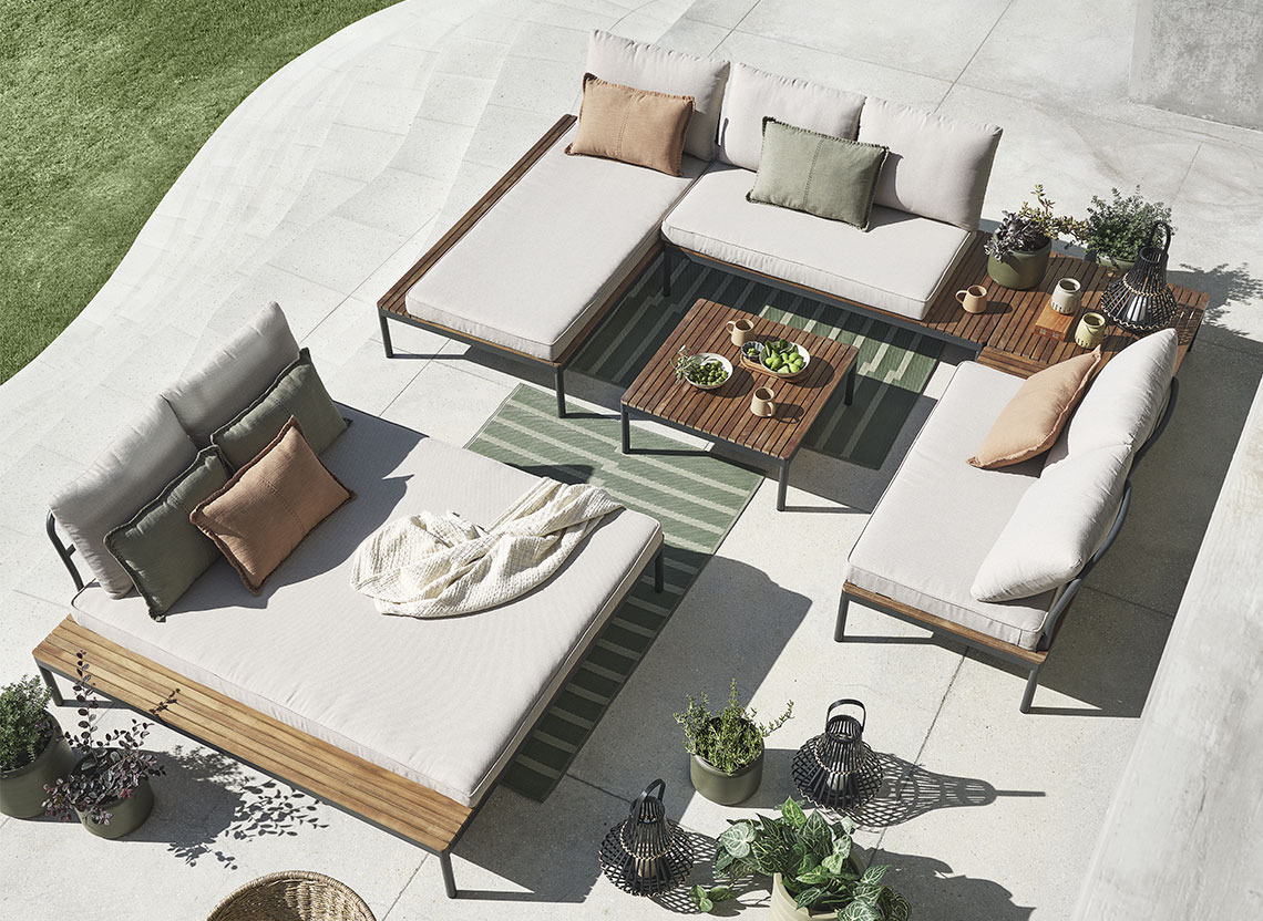 Garden lounge set combined of different modules on a patio