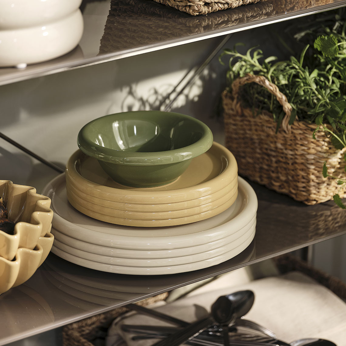 MALIK plates and bowl, NOR bowls Colourful plates and bowls on a shelf