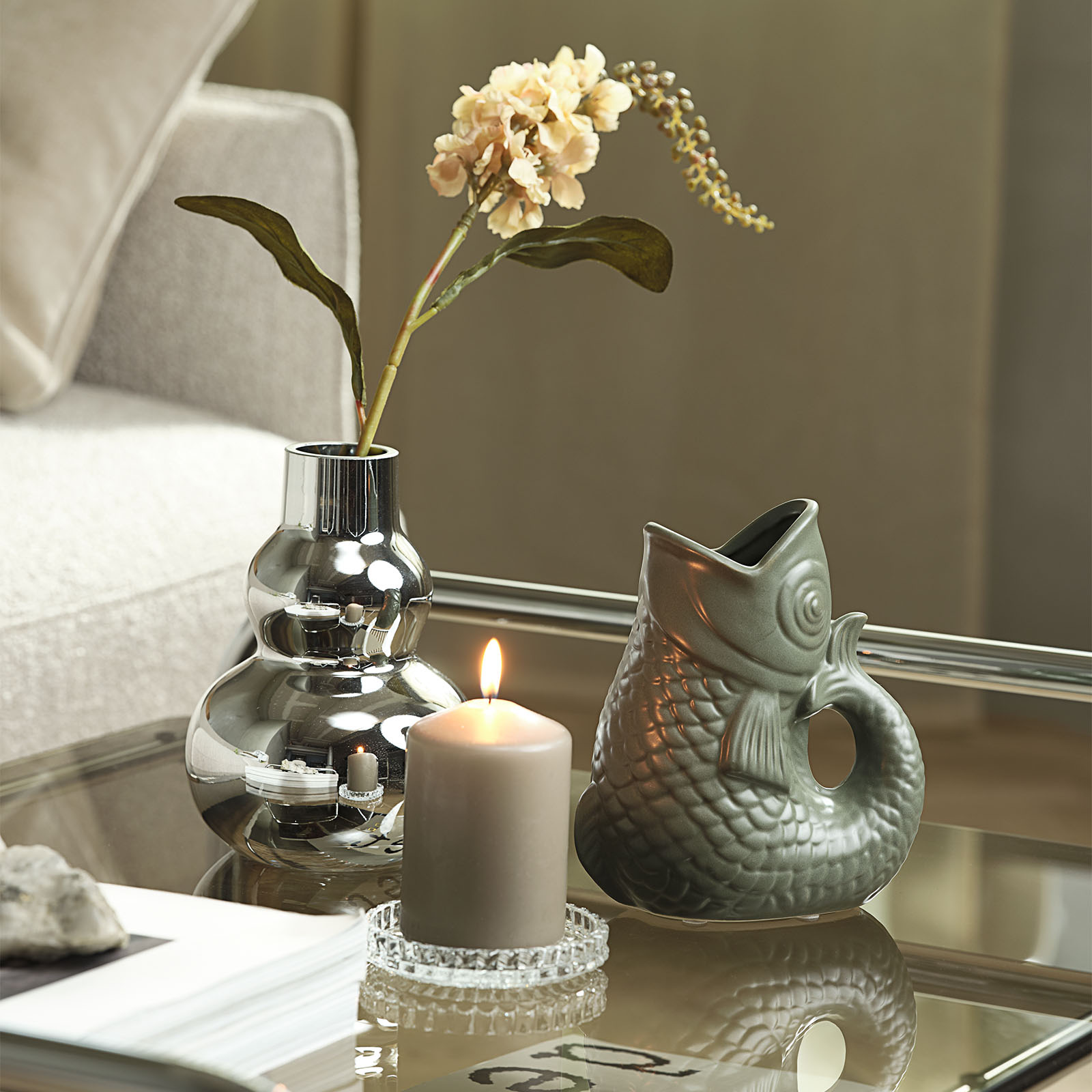CHRISTOFER vase with chrome-look finish Chrome vase with fish-shaped vase and candle on coffee table